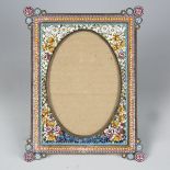 An early 20th century Italian micro-mosaic photograph frame, the oval aperture within a surround