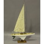 An early/mid-20th century painted pond yacht with cloth sails and string rigging, height 142cm,