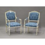 A pair of late 19th/early 20th century French white painted fauteuil armchairs, upholstered in