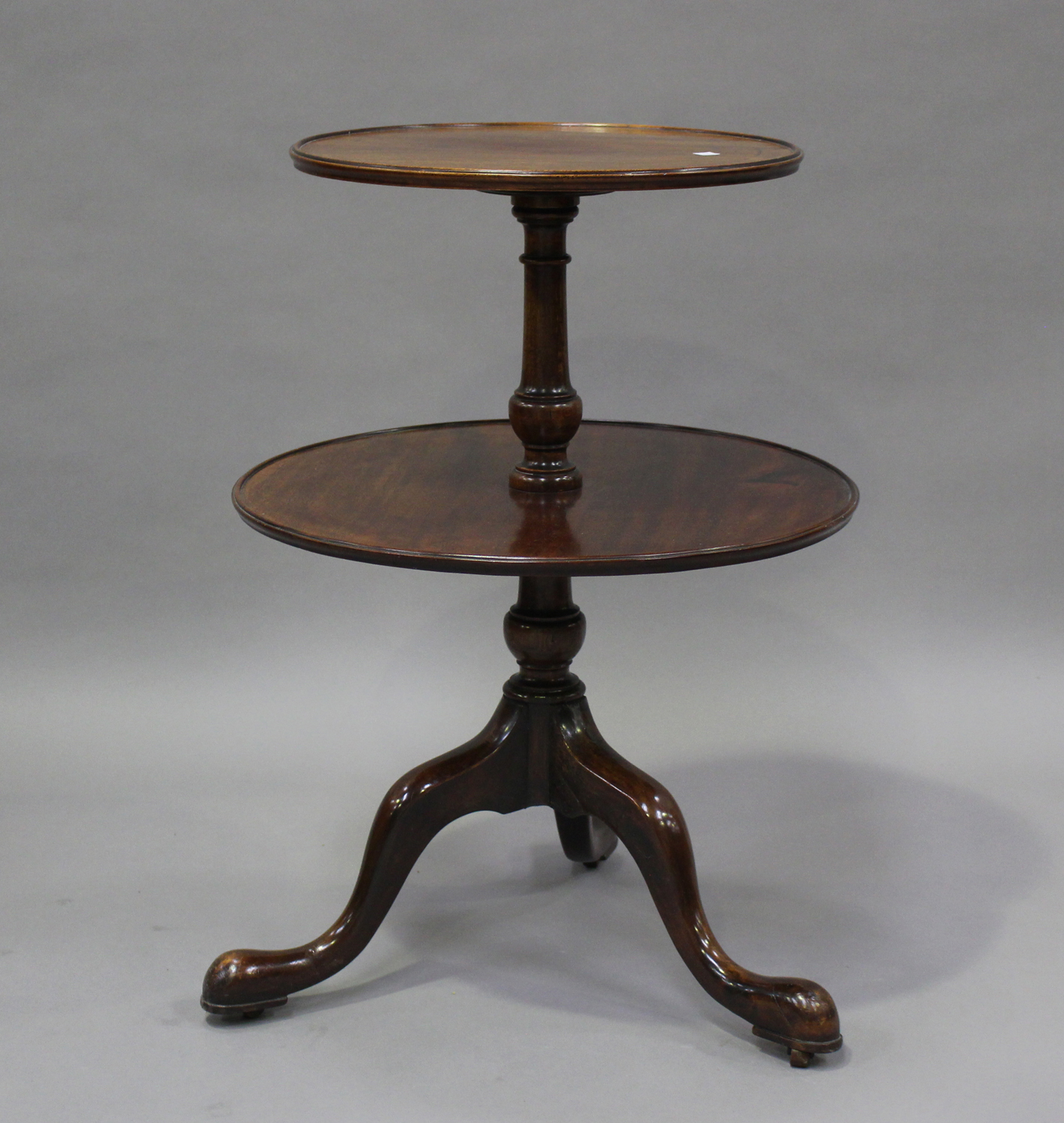 A George III and later mahogany circular two-tier dumb waiter, on tripod cabriole legs, height 81cm,