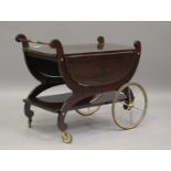 A mid/late 20th century Italian mahogany tea trolley, on gilt metal wheels, height 70cm, width 91cm,