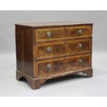 An 18th century oak and walnut chest of three drawers with crossbanded borders, on bracket feet,