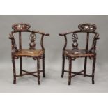 A pair of late 20th century Chinese hardwood and mother-of-pearl inlaid chairs, the solid seats on