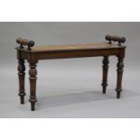 A late Victorian walnut window seat with ring turned handles and legs, height 32cm, width 90cm,