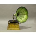 An early 20th century oak cased table-top gramophone, fitted with a green painted pressed metal