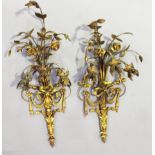 A pair of 20th century giltwood and gesso three-branch wall lights, height 80cm, width 30cm.Buyer’