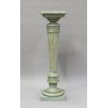A 20th century green and gilt painted display pedestal with a fluted stem, height 111cm, width