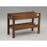 A mid/late 20th century teak two-division magazine rack, height 35cm, width 51cm, depth 20cm.Buyer’s