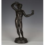 A 19th century Grand Tour darkly patinated cast bronze figure of Bacchus, holding a bunch of