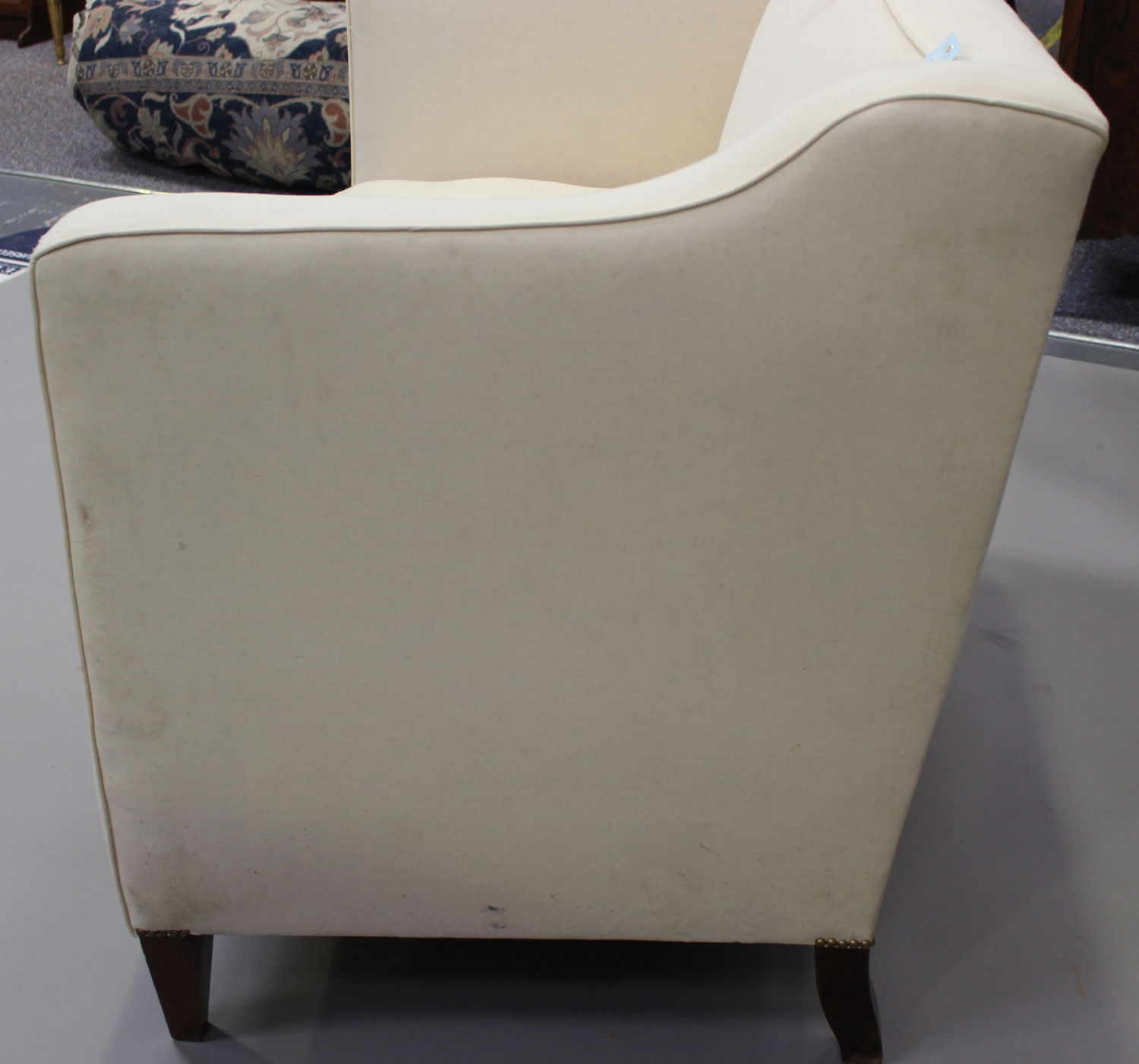 An early 20th century two-seat wing back settee, upholstered in calico, on square tapering block - Image 2 of 3