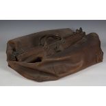 An early 20th century brown leather Gladstone bag, width 66cm.Buyer’s Premium 29.4% (including VAT @