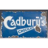 A Cadbury's Chocolate enamel advertising sign, 61cm x 35cm.Buyer’s Premium 29.4% (including VAT @