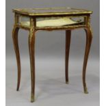 A late 19th/early 20th century French kingwood bijouterie table with gilt metal mounts, the hinged