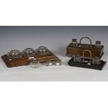 An Edwardian oak inkstand, fitted with three cut glass inkwells, length 37cm, together with two