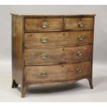 A George III mahogany bowfront chest, fitted with two short and three long drawers, on outswept