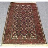 A Beluche prayer rug, Afghan/Persian borders, mid-20th century, the charcoal field with overall