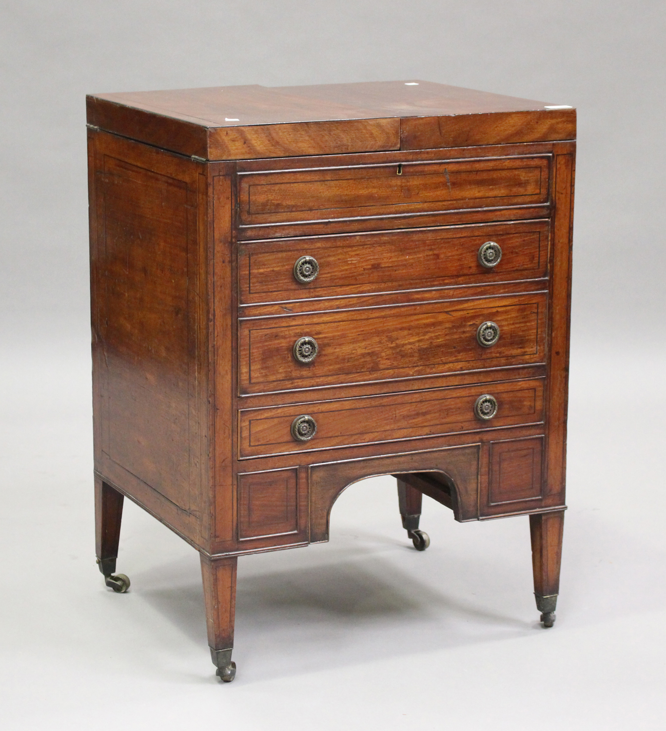 A George III mahogany dressing table, the double hinged top revealing a compartmentalized interior