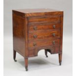 A George III mahogany dressing table, the double hinged top revealing a compartmentalized interior