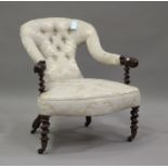 A 19th century mahogany framed scroll armchair, upholstered in blue damask, on barley twist legs,