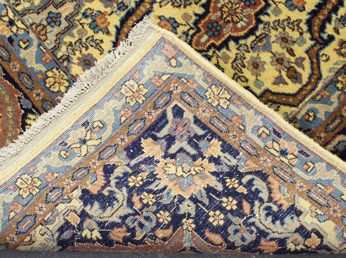 An Indian carpet, mid/late 20th century, the ivory field with an overall floral lattice, within a - Image 2 of 5