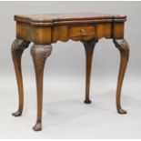 An early 20th century George I style walnut fold-over card table, fitted with a drawer, on