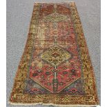 A Hamadan runner, North-west Persia, early 20th century, the blue field with three linked and