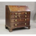 A George III mahogany bureau, the fall flap above four graduated long drawers, on bracket feet,