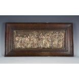 A late Victorian pressed copper Neoclassical Revival panel within an oak frame, 28cm x 56cm.Buyer’