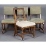 A set of four Victorian Gothic Revival oak framed chairs, in the manner of A.W.N. Pugin, the