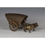 A late 19th century brown patinated bronze model of an ox-drawn carriage, bearing stamped