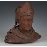 A late 19th/early 20th century Continental terracotta head and shoulders bust of a cardinal,