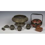A small collection of Eastern items, including a brass bowl and a papier-mâché box and lid.Buyer’s