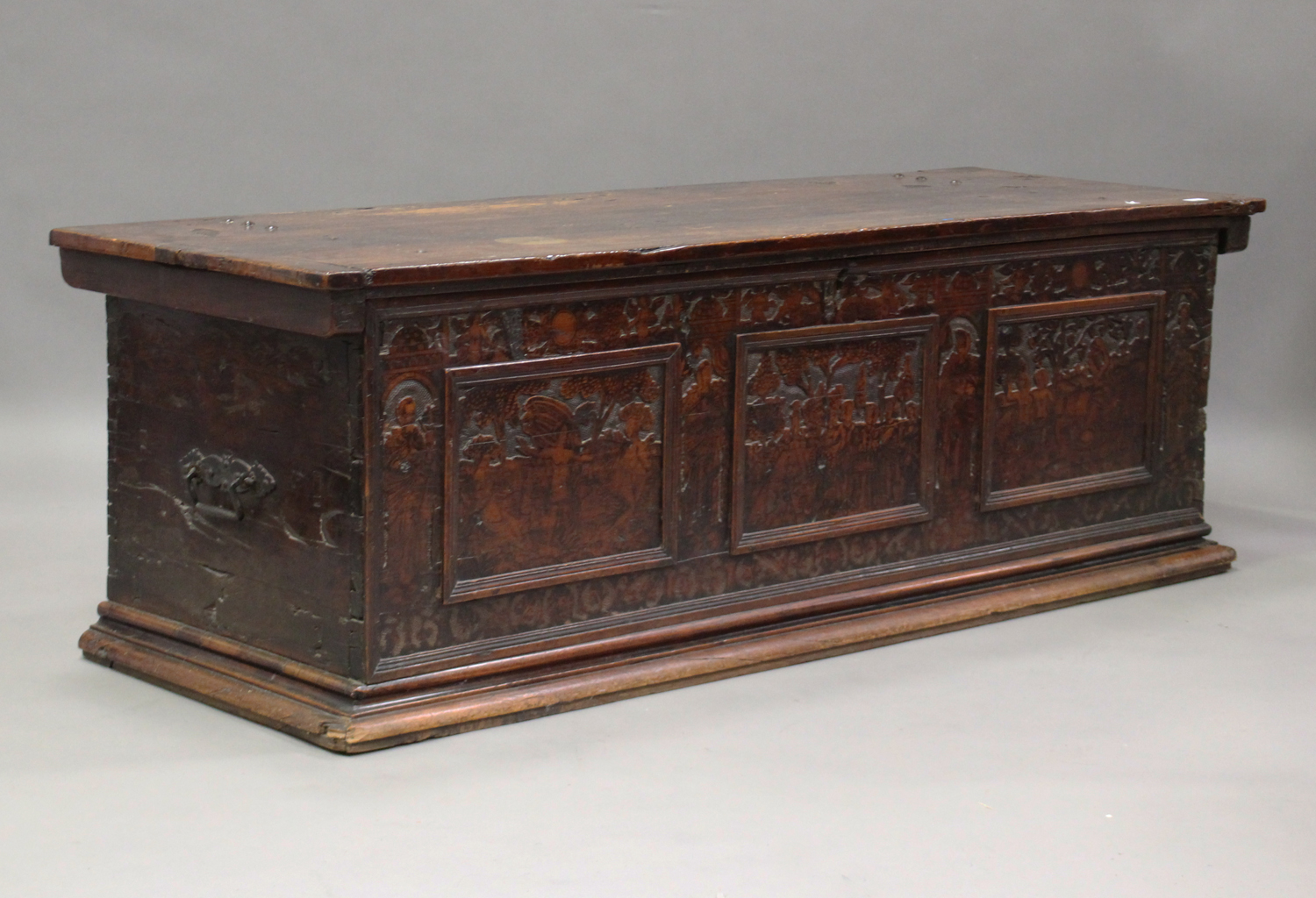 A large 17th century Italian cedar and walnut Adige chest, the lid hinged to reveal poker and pen