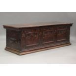 A large 17th century Italian cedar and walnut Adige chest, the lid hinged to reveal poker and pen