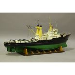 A late 20th century remote control model of the tugboat ship 'Lloydsman', finished in green and