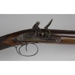 An early 19th century 16-bore double-barrelled flintlock sporting gun with Damascus barrels,