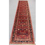 A Malayer runner, North-west Persia, mid-20th century, the red field with an overall foliate