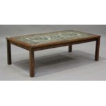 A mid-20th century Danish coffee table by 'Ox Art' for Trioh, the tiled top raised on block legs,