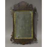 A George III mahogany fretwork wall mirror with inner gilt slip, 57cm x 34cm.Buyer’s Premium 29.