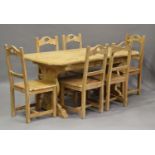 A 20th century pine dining table, height 73cm, length 161cm, depth 84cm, and six matching dining