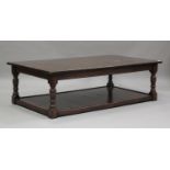 A modern oak two-tier coffee table, possibly by By-Law, on turned and block legs, height 47cm,