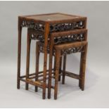 A 20th century Chinese hardwood nest of occasional tables, height 66cm, width 51cm, depth 35cm.