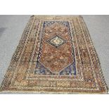 A Ghashghai rug, South-west Persia, early 20th century, the dark blue field with a lozenge medallion