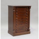 An early 20th century stained pine table-top Wellington chest, fitted with ten drawers, height 69cm,