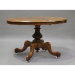 A Victorian burr walnut oval loo table, the baluster column carved with acanthus leaf scrolls, on