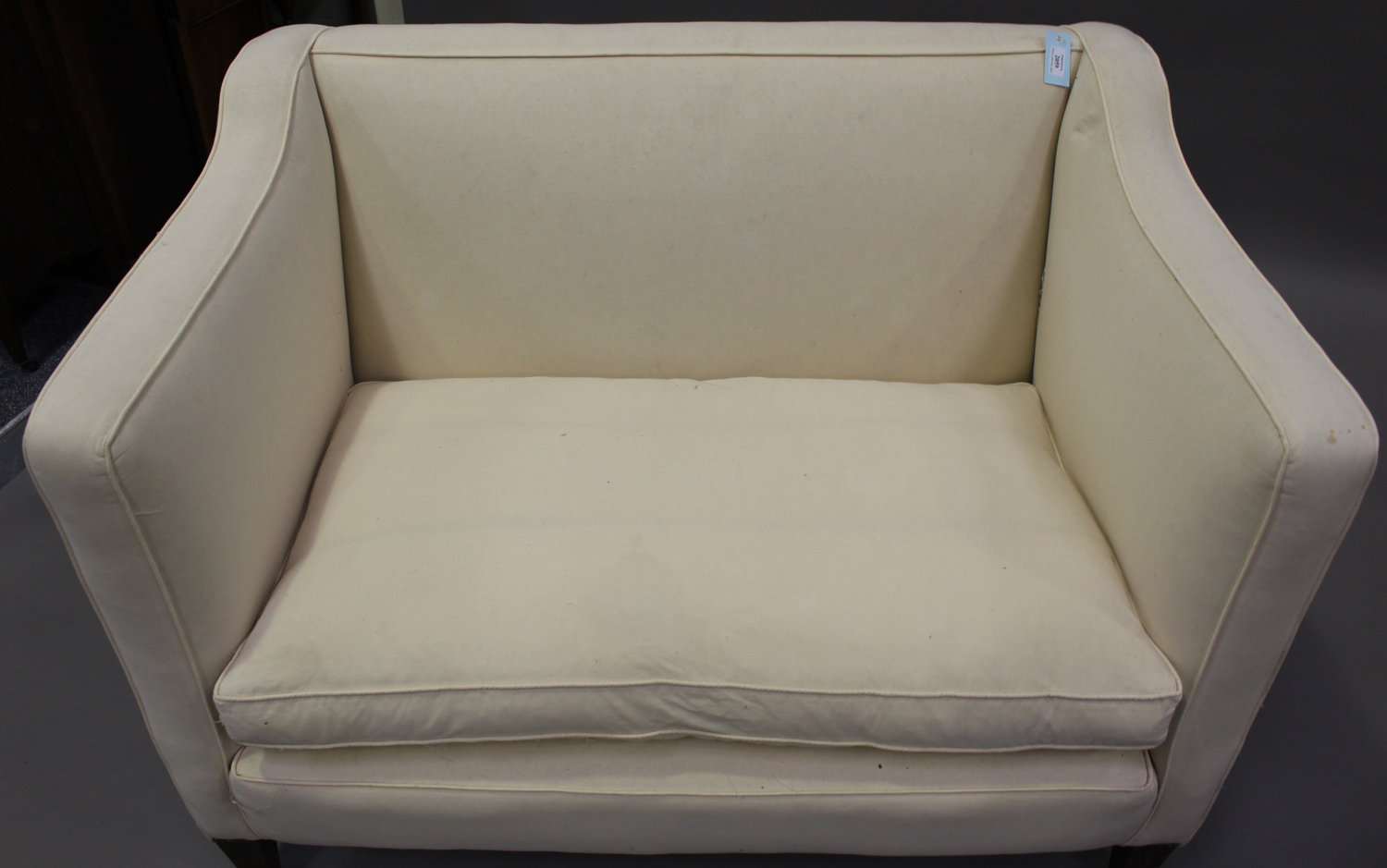 An early 20th century two-seat wing back settee, upholstered in calico, on square tapering block - Image 3 of 3