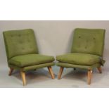 A pair of mid-20th century G-Plan E. Gomme 403 television chairs, upholstered in green fabric, on