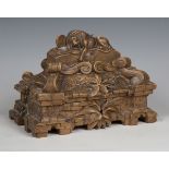 An early 20th century Swiss Black Forest carved walnut box, the lid modelled with the Lion of