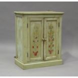 A 20th century painted pine two-door cupboard, on a plinth base, height 72cm, width 60cm, depth