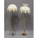 An early 20th century brass lamp standard and a giltwood lamp standard.Buyer’s Premium 29.4% (